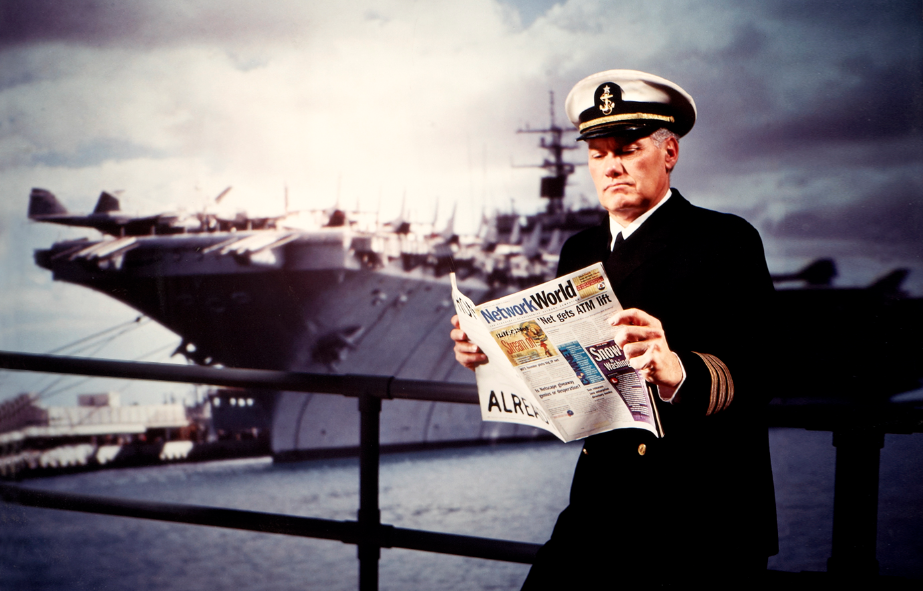 Boat captain reading newspaper