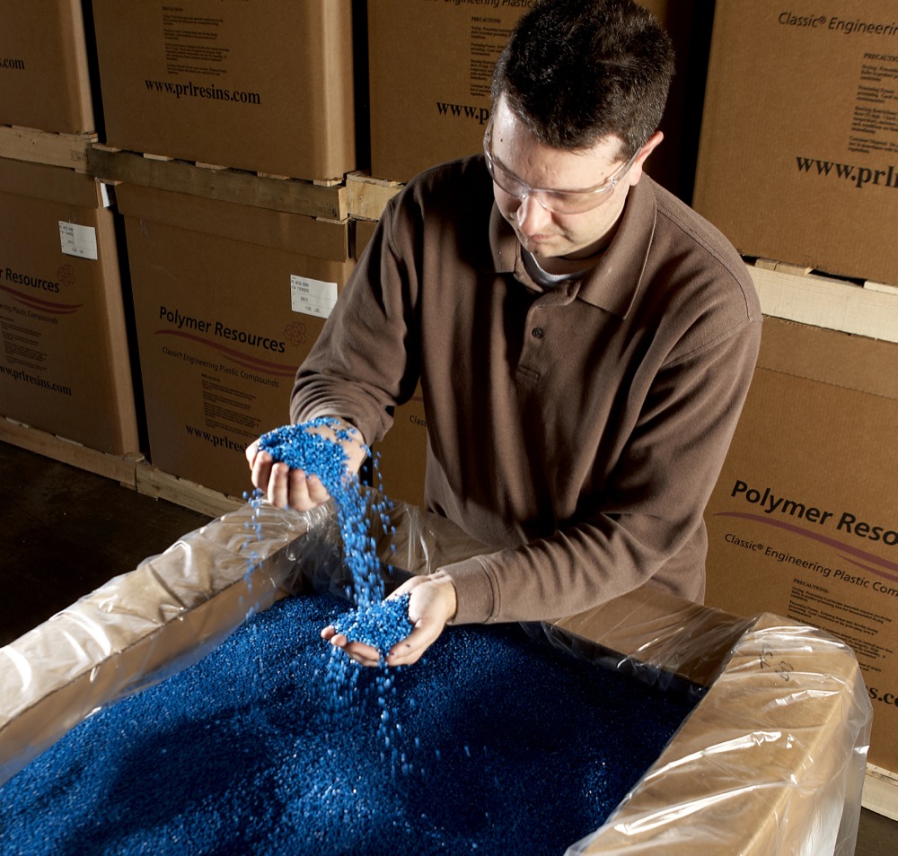 Man working with shipping pellets