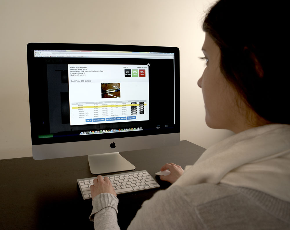 Woman using Macintosh computer